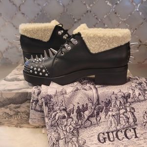 GUCCI spiked and shearling black leather boots